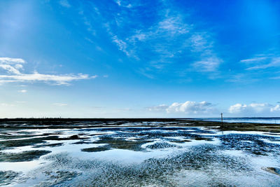 Scenic view of sea against sky during winter