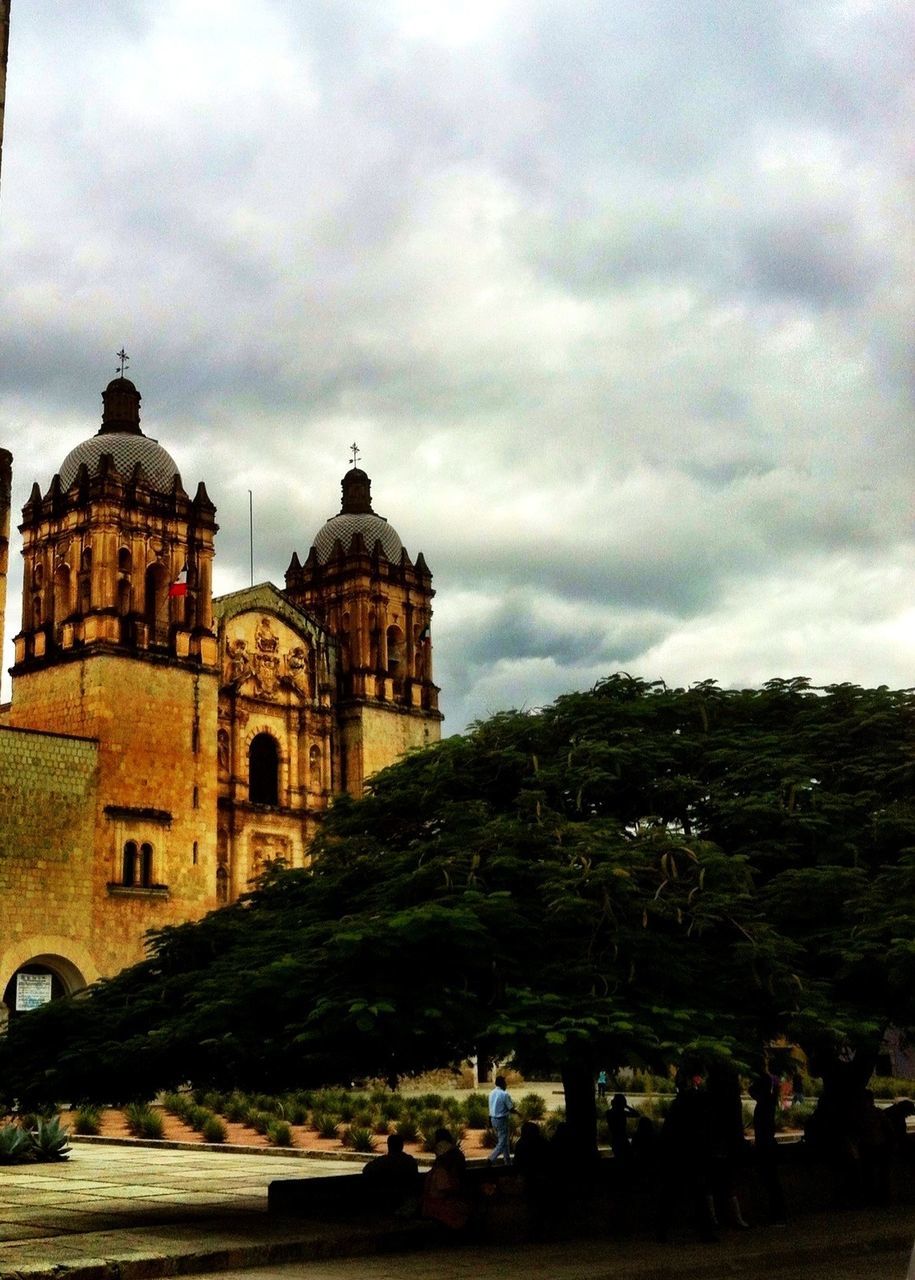 building exterior, architecture, built structure, sky, cloud - sky, cloudy, church, place of worship, weather, cloud, tree, religion, history, spirituality, dome, overcast, outdoors, house, castle