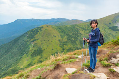 Rear view of man standing on mountain