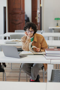 Young woman using laptop at home