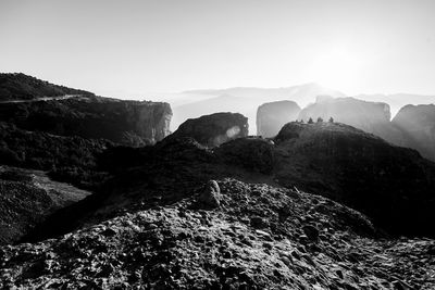 Rocks in mountains against clear sky