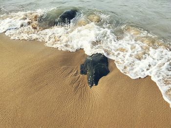 High angle view of surf on beach