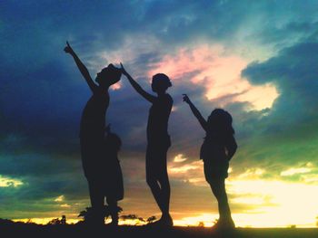 Silhouette of people at sunset