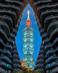 Low angle view of illuminated taipei 101 at night