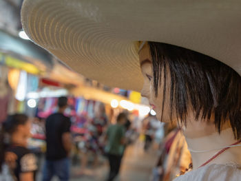 Rear view of people in illuminated hat