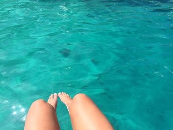 Low section of woman in swimming pool