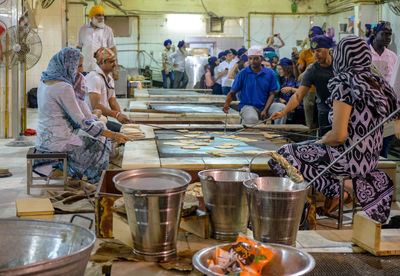 Group of people at market stall