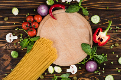 Directly above shot of fruits and vegetables on cutting board