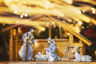 Illuminated lighting equipment on table at night