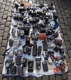 High angle view of cameras at flea market for sale