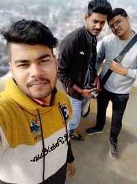 Portrait of friends standing outdoors