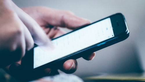 Close-up of hand holding smart phone