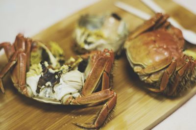 Close-up of crabs on cutting board