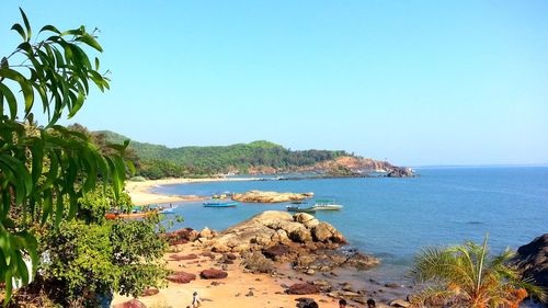 Scenic view of sea against clear blue sky