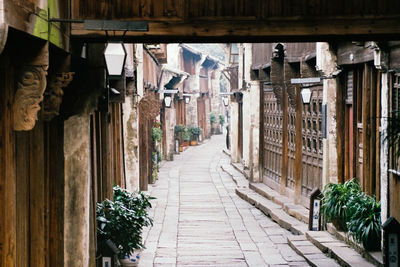 Walkway amidst buildings