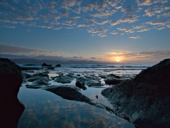 Scenic view of sea against sky during sunset