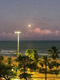 Scenic view of sea against sky at night