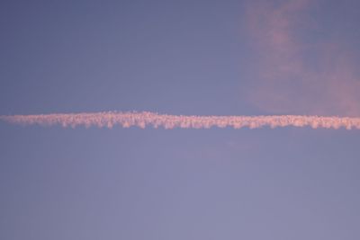 Vapor trail in sky at night