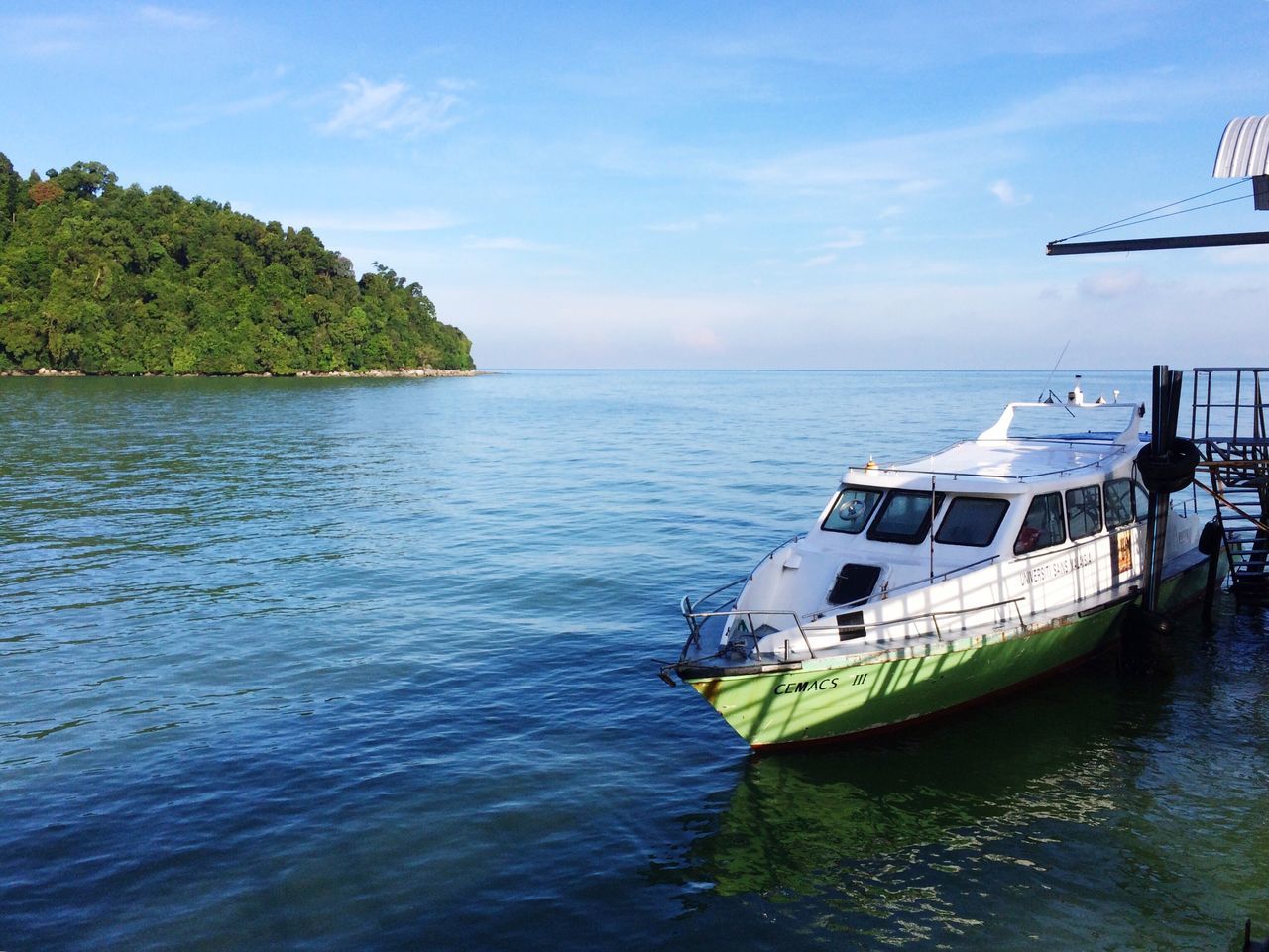 water, nautical vessel, waterfront, sea, transportation, boat, mode of transport, sky, rippled, horizon over water, moored, cloud - sky, tranquil scene, nature, tranquility, scenics, cloud, beauty in nature, sailing, day