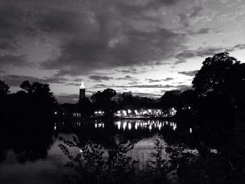 Scenic view of river against cloudy sky