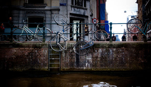 Bicycle by building in city