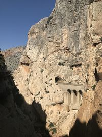 Low angle view of rock formations against sky