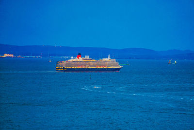 Scenic view of sea against clear blue sky