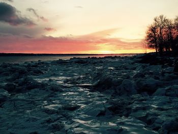 Scenic view of sea at sunset