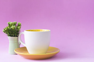 Close-up of coffee cup on table