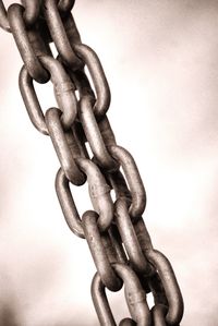 Close-up of chain against white background