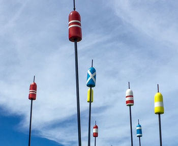 Low angle view of street lights against sky