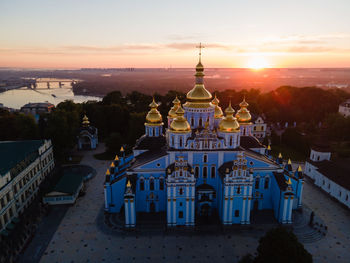 High angle view of buildings against sky during sunset