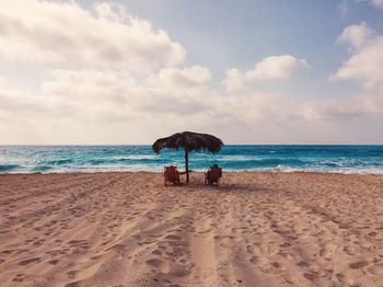 Scenic view of beach against sky