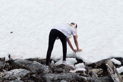 Woman standing on rock