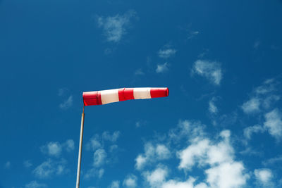 Low angle view of flag against sky