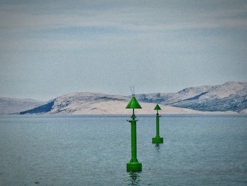 Scenic view of sea against mountain