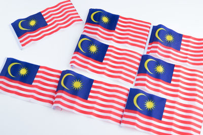 High angle view of multi colored pencils on white background