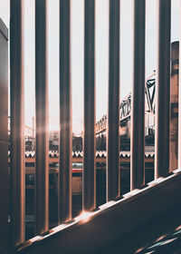 Panoramic view of city buildings seen through window