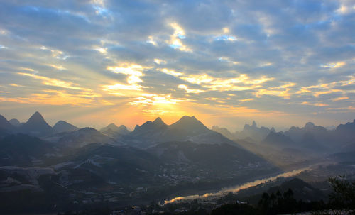 Scenic view of mountains against sky during sunset