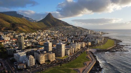 High angle view of cityscape against sky - table mountain and lions head in south africa - cape town