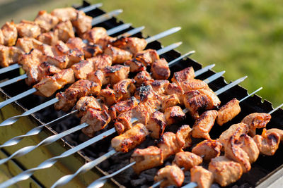 Close-up of meat on barbecue grill