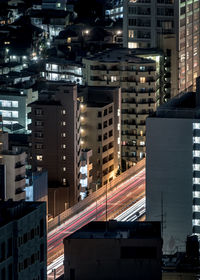 Illuminated buildings in city at night