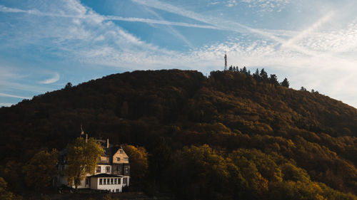 View of temple against building and mountain