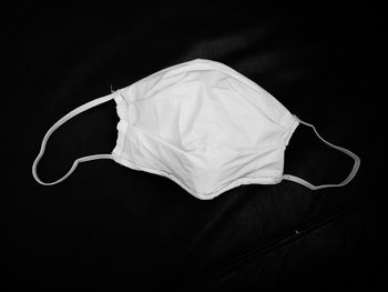 High angle view of mannequin against black background