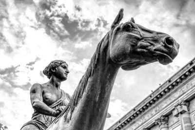 Low angle view of statue against sky