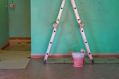 Empty chairs against wall at home