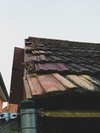 Tilt image of built structure against clear sky