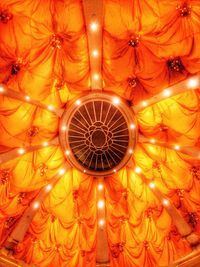 Low angle view of illuminated ceiling