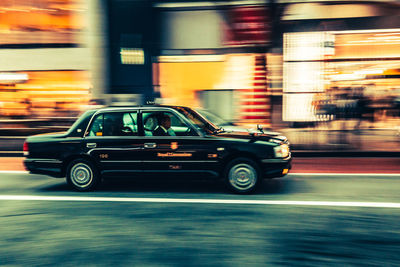 Vintage car on road at night