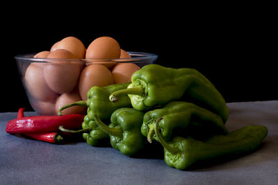 Close-up of bell peppers against black background